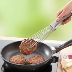 Die moderne Hausfrau Küchenzange